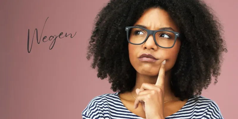 Woman thinking about whether the German preposition wegen can take the dative case.
