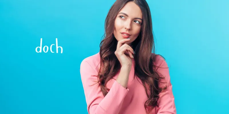 Woman thinking about how to use doch in German sentences.