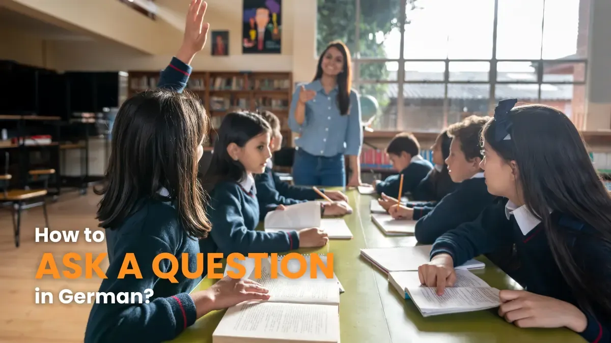 Classroom scene with a student raising her hand to ask a question, learning how to form questions in German.