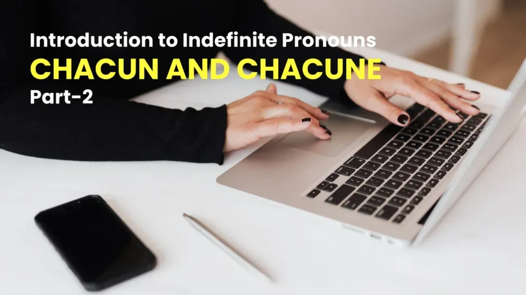 Hands typing on a laptop during a French lesson on the indefinite pronouns chacun and chacune, part 2.