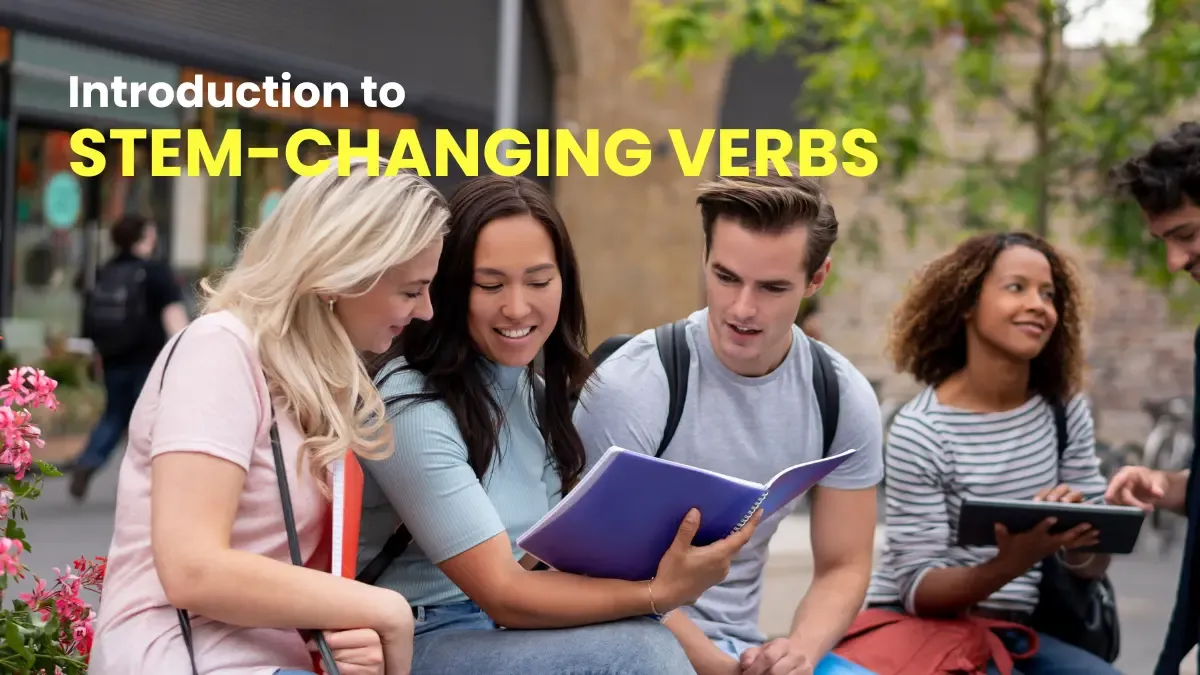 Students looking at a notebook and learning about stem-changing verbs in German.