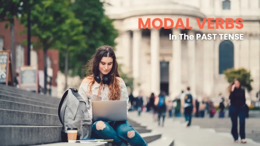Student studying outdoors on university steps, wearing headphones and focused on her laptop, learning modal verbs in the past tense in German.