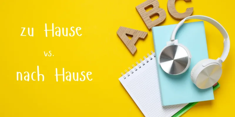 Notebook, headphones and letter blocks illustrating zu Hause versus nach Hause in German.