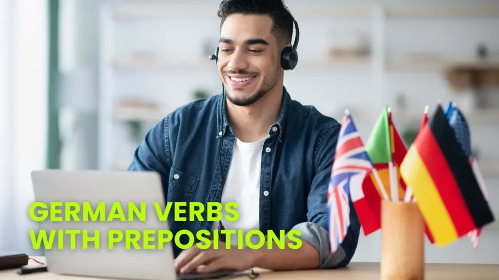 Smiling student with headphones studying German verbs with prepositions, surrounded by flags representing language diversity.