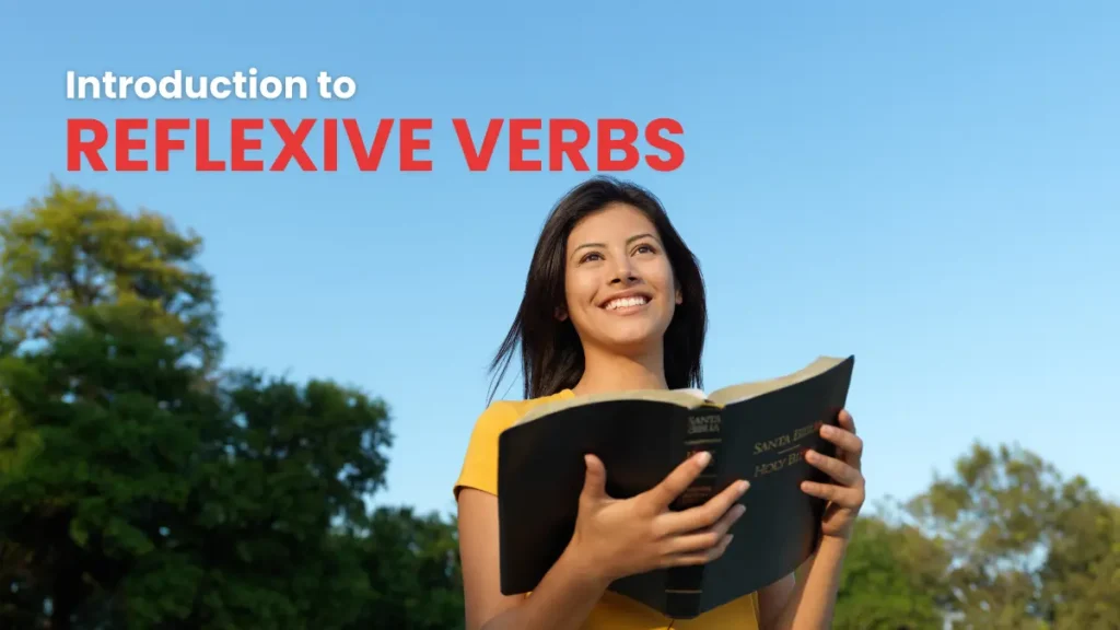 Joyful young woman outdoors, wearing headphones, holding an open book and looking skyward, learning about reflexive verbs.