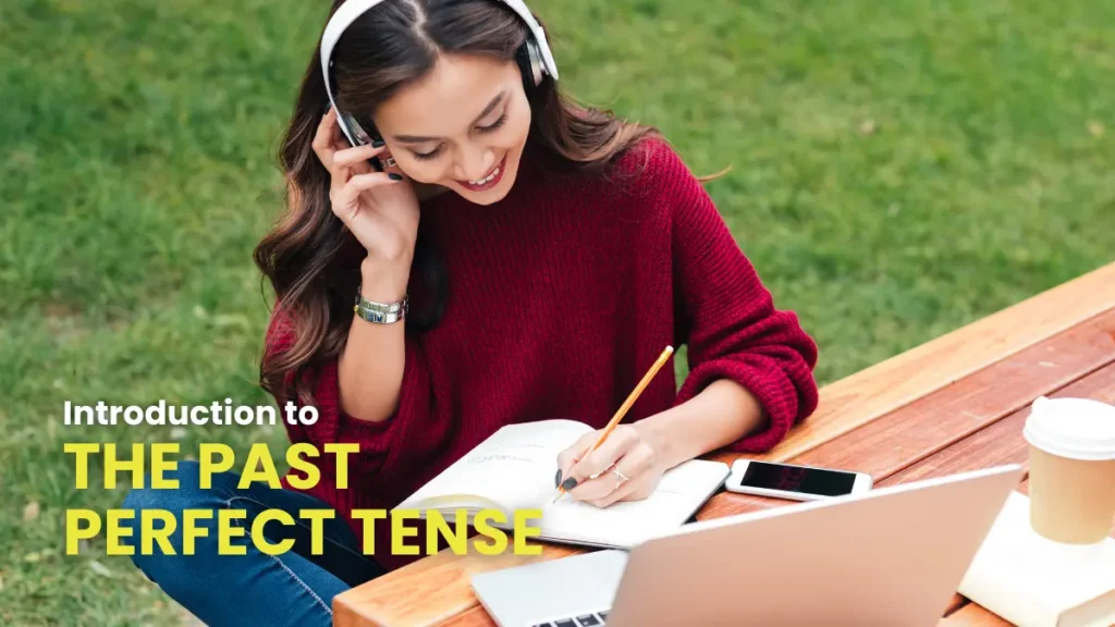 Dedicated learner studying the past perfect tense in German, enjoying a peaceful outdoor setting while taking notes and listening through headphones.