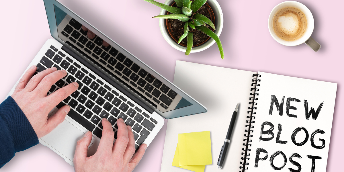 Hands typing on a laptop with a notebook displaying 'New Blog Post' alongside a plant and coffee cup, representing the Grammar Made Simple blog page where various German grammar rules are discussed.