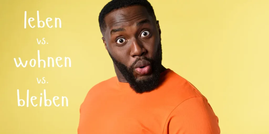 A man with a surprised expression as he grasps the nuances between 'leben', 'wohnen', and 'bleiben' in German.